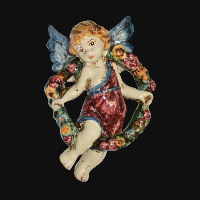 Angelo in ceramica di Caltagirone fatto a mano con ali blu e ghirlanda floreale colorata